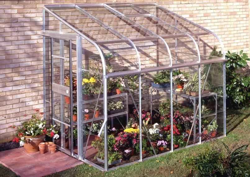 Serre de jardin en verre adossee

